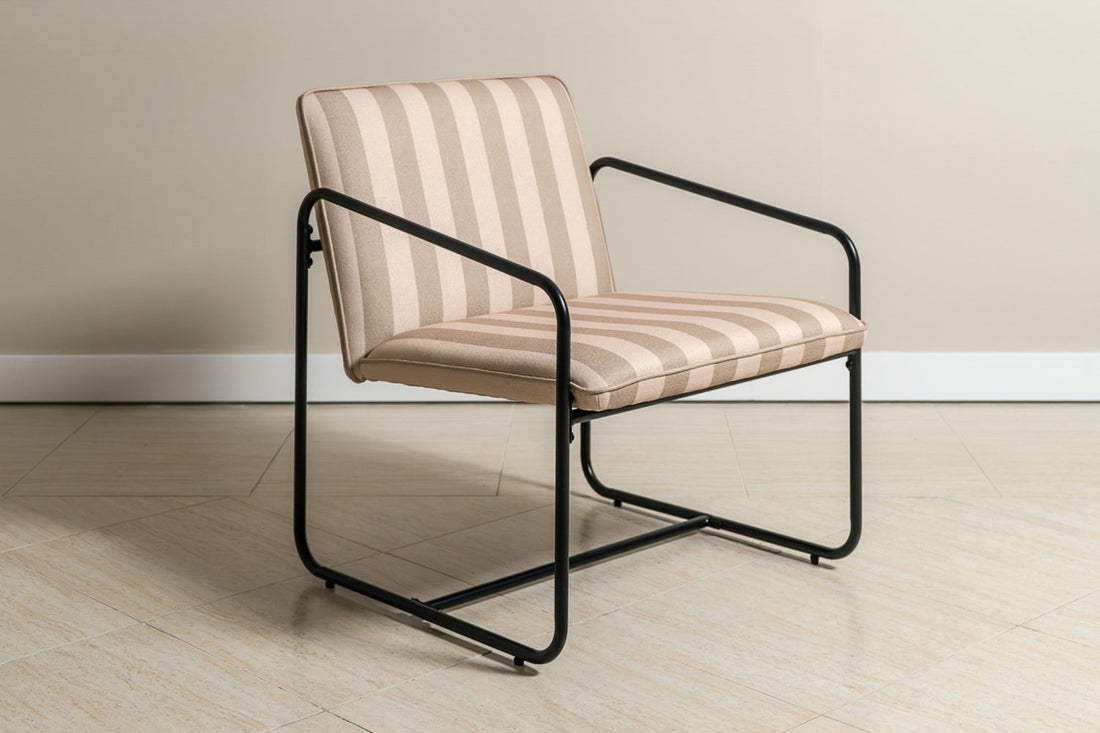 The Berria Armchair in Dune Sand adds a peaceful, coastal feel to any living space.
