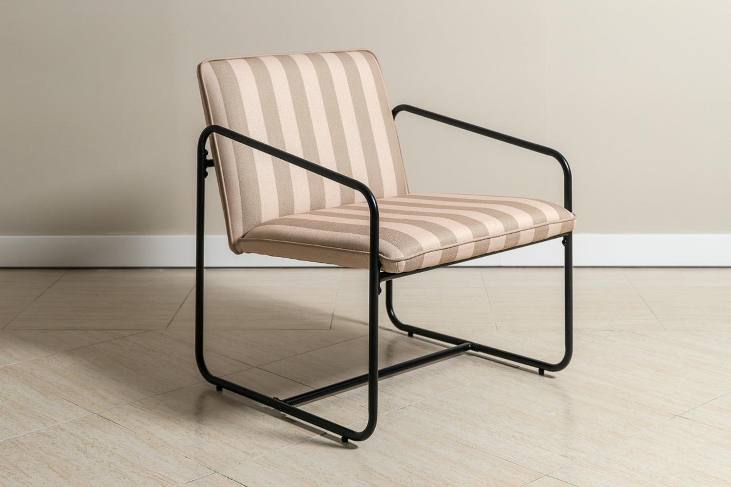The Berria Armchair in Dune Sand adds a peaceful, coastal feel to any living space.