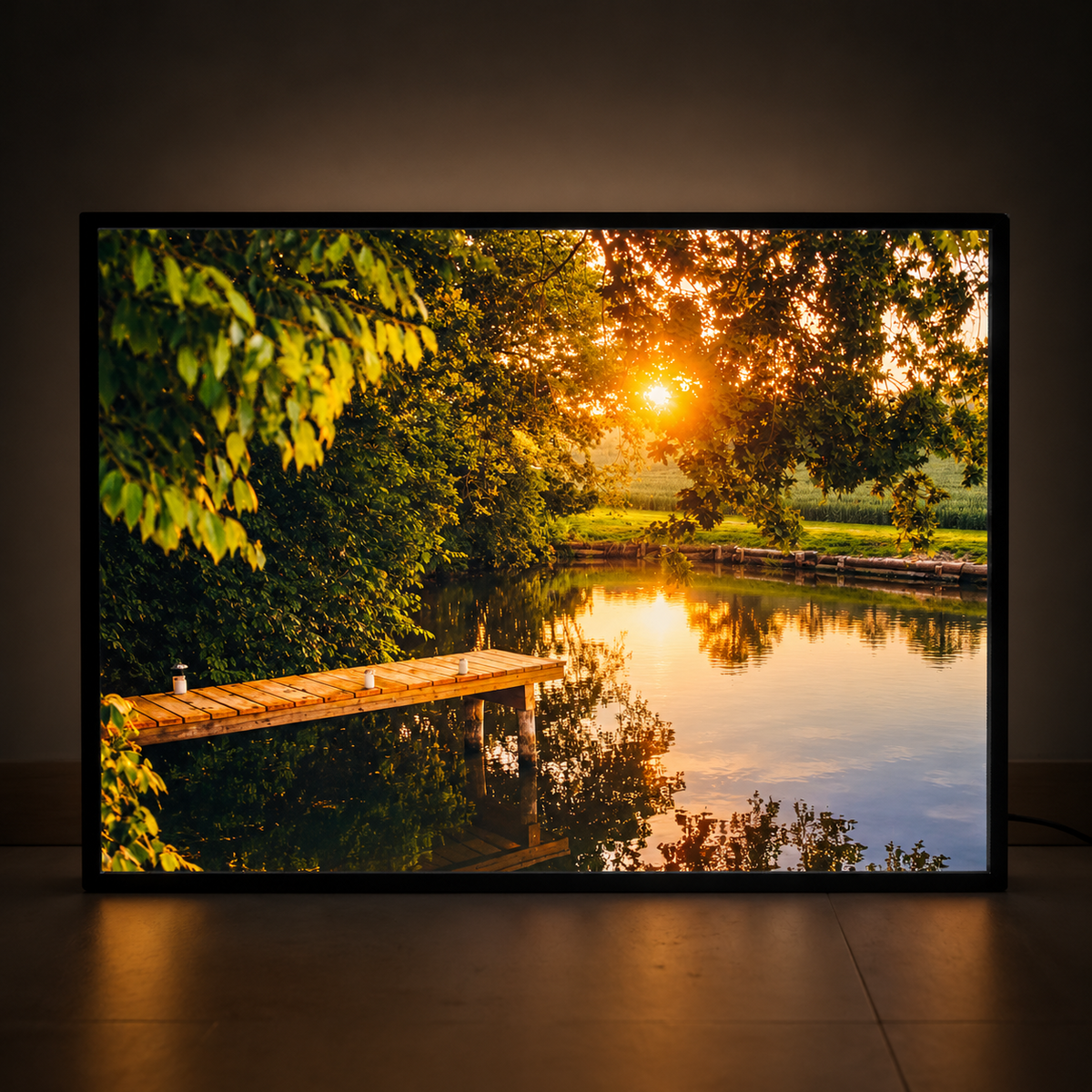 Illuminated photo lightbox featuring a lakeside sunset with trees, reflections and a wooden jetty