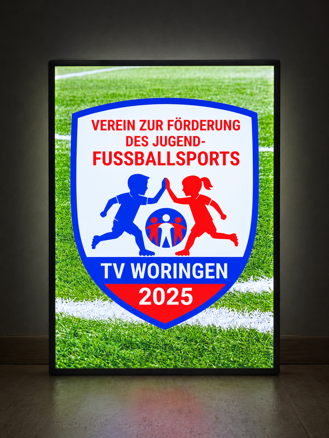 Illuminated photo lightbox featuring the TV Woringen youth football emblem