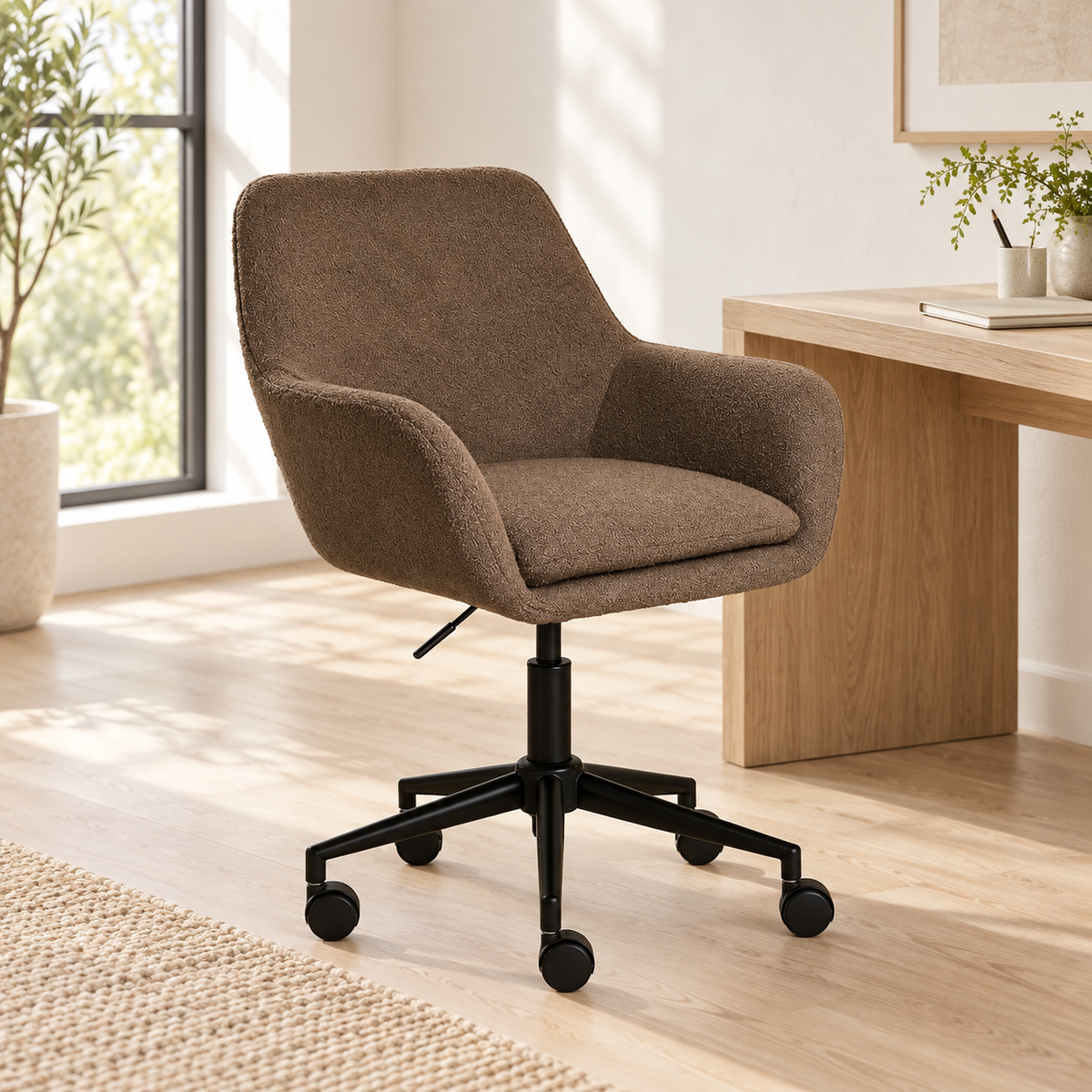 Smoked Oak Brown bouclé desk chair beside a pale oak desk in a bright home workspace