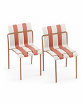 Two matching Ondara armless dining chairs in beige on a white background