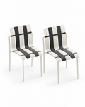 Two matching Ondara armless dining chairs in black-white on a white background