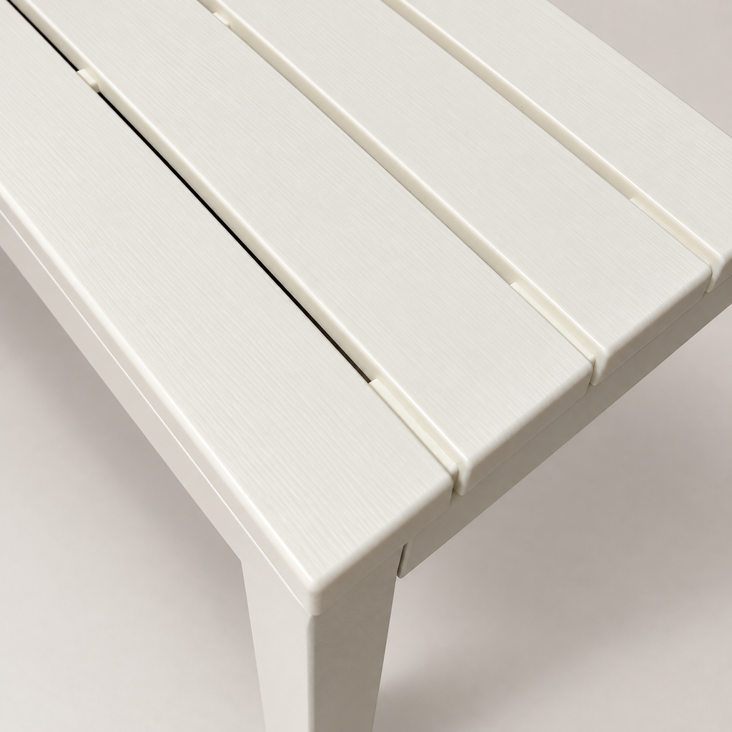 Close-up of the Ondara white table showing the textured slatted tabletop, rounded edges and corner